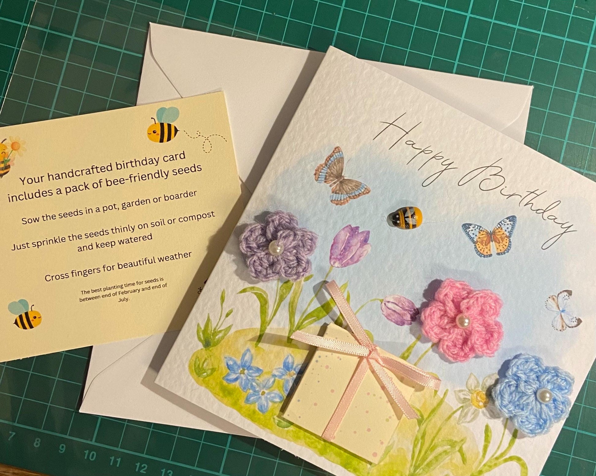 handmade birthday card featuring crochet flowers and includes a packet of bee friendly flower seeds