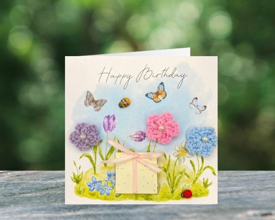 handmade birthday card featuring crochet flowers and includes a packet of bee friendly flower seeds