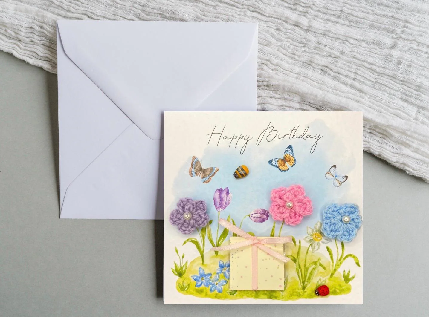 unique handmade birthday card featuring crochet flowers and includes a packet of bee friendly flower seeds