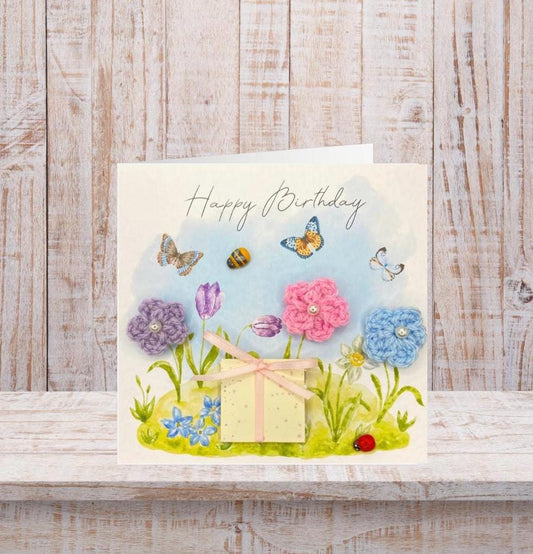 handmade birthday card featuring crochet flowers and includes a packet of bee friendly flower seeds